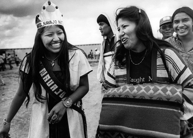 A happy Navajo Nation queen interacts with friends.
