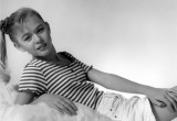 Young girl kicking it easy in a studio portrait