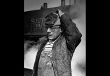 At a San Jose train yard a locomotive mechanic takes time for a portrait