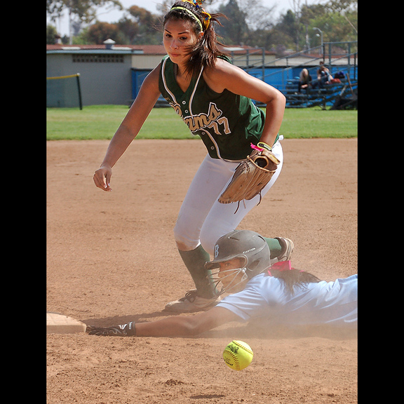 2013 - A third baseman lets the ball get away after a throw from the catcher. 